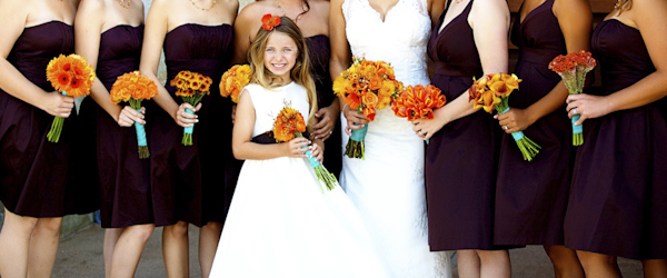 flower girl holding bouquet of flowers - wedding photo by top Orange County, California wedding photographers D. Park Photography